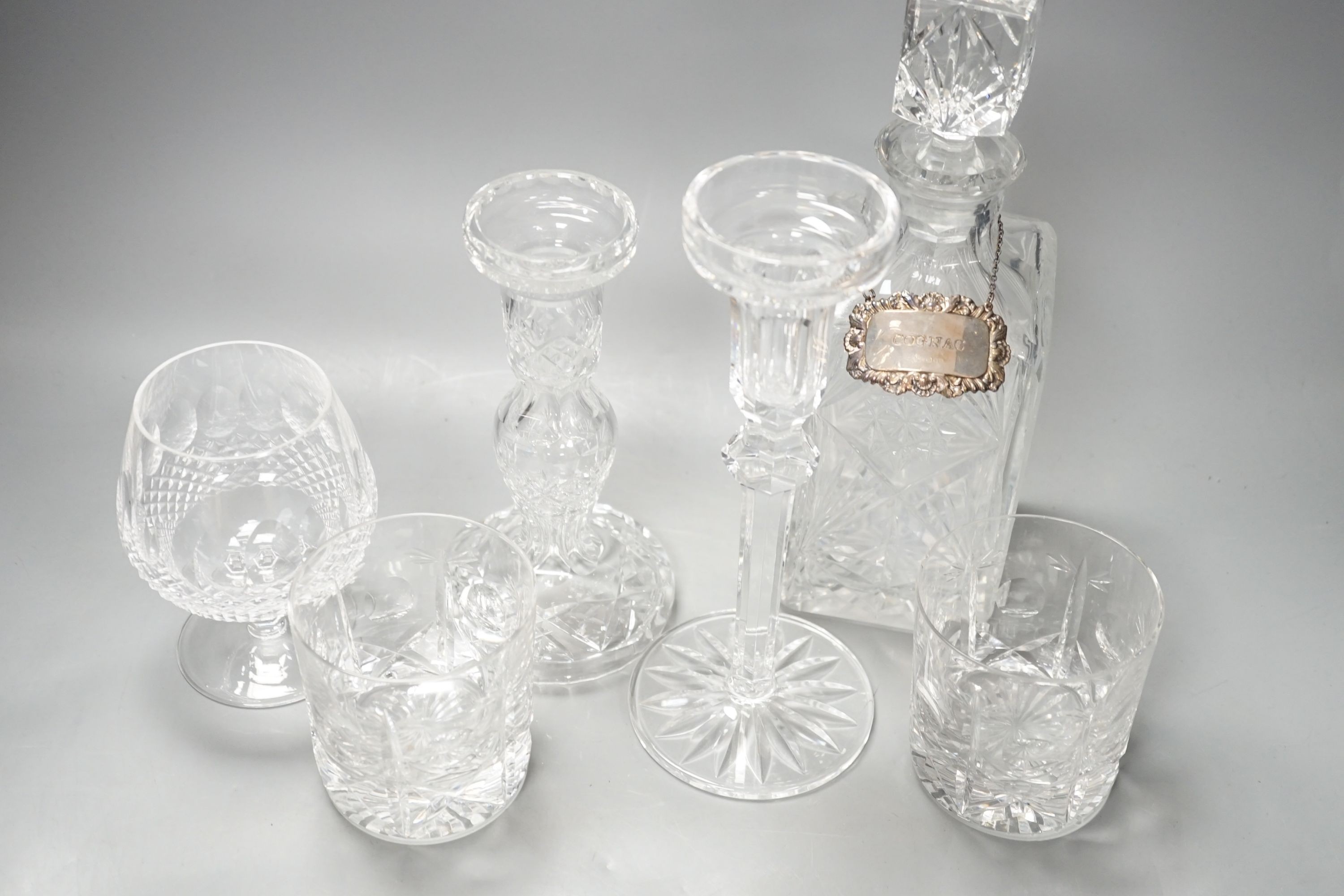 Assorted glassware including six decanters, each with a modern silver wine label